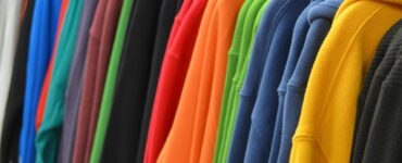 Sports Costume Ideas image of a rack of colourful sweatshirts